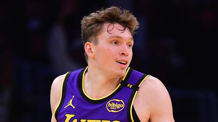 Nov 19, 2024; Los Angeles, California, USA; Los Angeles Lakers guard Dalton Knecht (4) react after scoring a three point basket against the Utah Jazz during the second half at Crypto.com Arena. Mandatory Credit: Gary A. Vasquez-Imagn Images