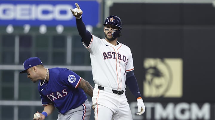 Houston Astros third baseman Carlos Correa (1) reacts after hitting a double during the first inning against the Texas Rangers at Daikin Park. 