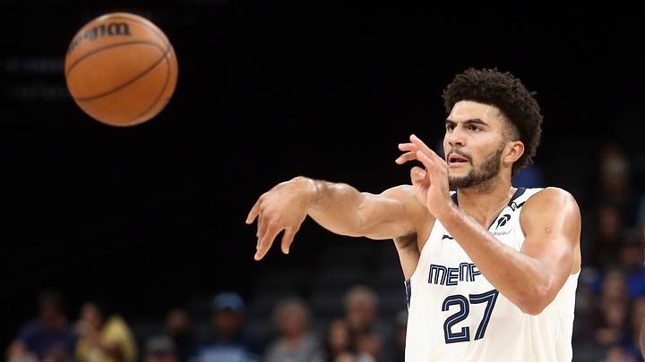 Oct 7, 2026; Memphis, Tennessee, USA; Memphis Grizzlies forward Cameron Boozer (27) passes the ball as Orlando Magic forward Jamal Cain (8) defends during the third quarter at FedExForum. Mandatory Credit: Petre Thomas-Imagn Images Oct 7, 2026; Memphis, Tennessee, USA; Memphis Grizzlies forward Cameron Boozer (27) passes the ball as Orlando Magic forward Jamal Cain (8) defends during the third quarter at FedExForum. Mandatory Credit: Petre Thomas-Imagn Images