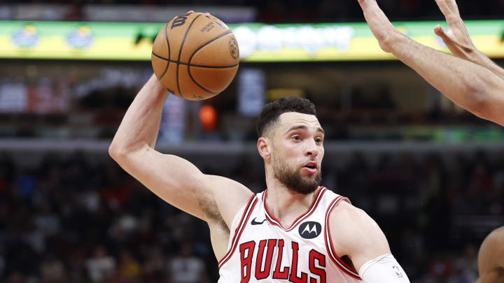 Jan 12, 2024; Chicago, Illinois, USA; Chicago Bulls guard Zach LaVine (8) drives against Golden State Warriors forward Trayce Jackson-Davis (32) during the second half at United Center. Mandatory Credit: Kamil Krzaczynski-USA TODAY Sports