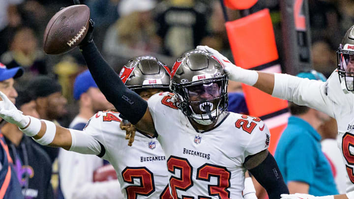 Oct 13, 2024; New Orleans, Louisiana, USA; Tampa Bay Buccaneers safety Tykee Smith (23) celebrates an interception of a ball intended for New Orleans Saints wide receiver Rashid Shaheed (22) with cornerback Tyrek Funderburk (24) and linebacker Joe Tryon-Shoyinka (9) during the fourth quarter at Caesars Superdome. Mandatory Credit: Matthew Hinton-Imagn Images