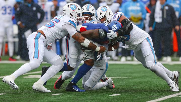 Sep 27, 2026; East Rutherford, New Jersey, USA; New York Giants wide receiver Malik Nabers (1) is tackled by Tennessee Titans defensive tackle Solomon Thomas (90) during the first half at MetLife Stadium. Mandatory Credit: Vincent Carchietta-Imagn Images Sep 27, 2026; East Rutherford, New Jersey, USA; New York Giants wide receiver Malik Nabers (1) is tackled by Tennessee Titans defensive tackle Solomon Thomas (90) during the first half at MetLife Stadium. Mandatory Credit: Vincent Carchietta-Imagn Images