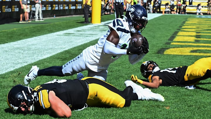 Sep 14, 2025; Pittsburgh, Pennsylvania, USA; Seattle Seahawks cornerback Derion Kendrick (1) intercepts a pass over Pittsburgh Steelers tight end Pat Freiermuth (88) and wide receiver Calvin Austin III (19) during the second half at Acrisure Stadium. Sep 14, 2025; Pittsburgh, Pennsylvania, USA; Seattle Seahawks cornerback Derion Kendrick (1) intercepts a pass over Pittsburgh Steelers tight end Pat Freiermuth (88) and wide receiver Calvin Austin III (19) during the second half at Acrisure Stadium.