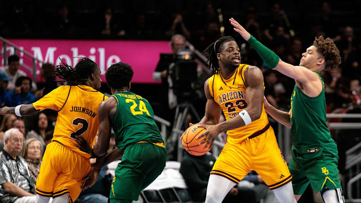 Mar 10, 2026; Kansas City, MO, USA; Arizona State Sun Devils forward Allen Mukeba (23) protects the ball from Baylor Bears guard Dan Skillings Jr. (0) during the second half at T-Mobile Center. Mandatory Credit: William Purnell-Imagn Images