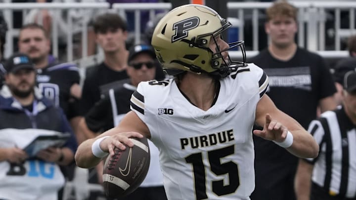 Purdue Boilermakers quarterback Ryan Browne (15) passes the ball