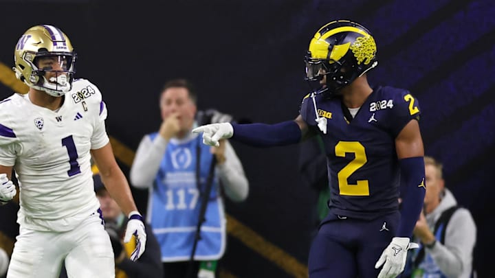 Washington Huskies wide receiver Rome Odunze (1) and Michigan Wolverines Will Johnson