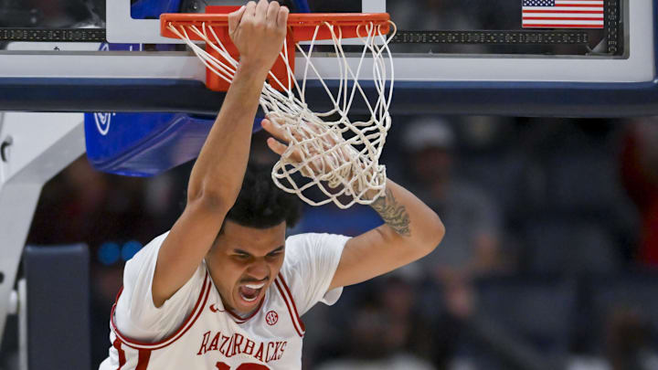 Arkansas Razorbacks forward Malique Ewin (12) dunks the ball against the Mississippi Rebels during the second half at Bridgestone Arena. 