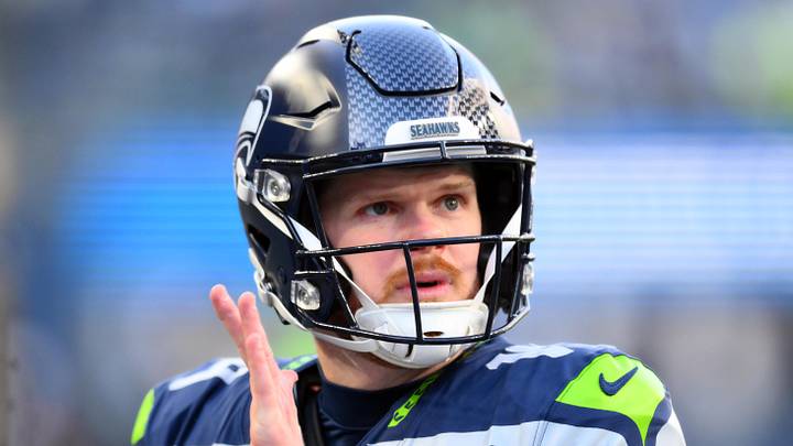 Seattle Seahawks quarterback Sam Darnold claps his hands