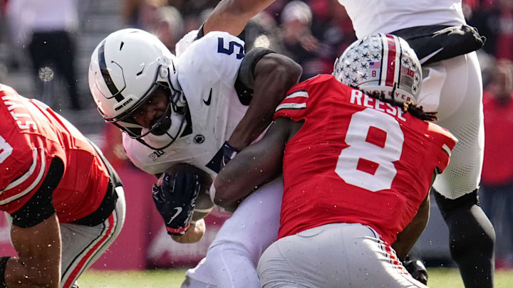 Ohio State Buckeyes linebacker Arvell Reese (8) hits Penn State Nittany Lions wide receiver Devonte Ross (5) beside cornerback Lorenzo Styles Jr. (3) during the NCAA football game at Ohio Stadium in Columbus on Nov. 1, 2025.