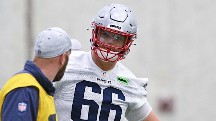 Jun 10, 2025; Foxborough, MA, USA; New England Patriots offensive tackle Will Campbell (66) works with a member of the coaching staff during minicamp held in the WIN Field House at Gillette Stadium. Mandatory Credit: Eric Canha-Imagn Images