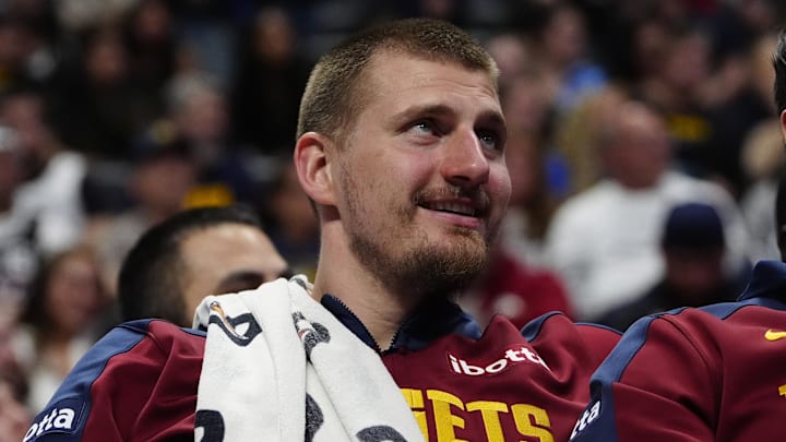 Mar 28, 2025; Denver, Colorado, USA; Denver Nuggets center Nikola Jokic (15) reacts from the bench in the fourth quarter against the Utah Jazz at Ball Arena. Mandatory Credit: Ron Chenoy-Imagn Images Mar 28, 2025; Denver, Colorado, USA; Denver Nuggets center Nikola Jokic (15) reacts from the bench in the fourth quarter against the Utah Jazz at Ball Arena. Mandatory Credit: Ron Chenoy-Imagn Images