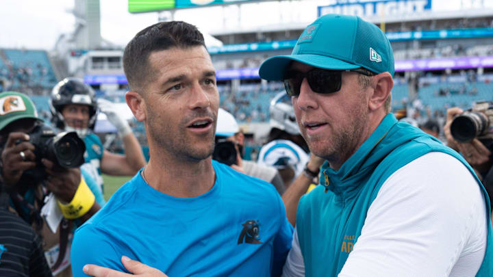 Carolina Panthers head coach Dave Canales and Carolina Panthers head coach Liam Coen met at the center of the field after the game between the Carolina Panthers at Jacksonville Jaguars at EverBank Stadium Sunday September 7, 2025. Jaguars defeated the Panthers 26-10. [Doug Engle/Florida Times-Union]