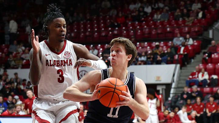 Dec 29, 2025; Tuscaloosa, Alabama, USA; Yale Bulldogs guard Trevor Mullin (11) drives to the basket against Alabama Crimson Tide guard Latrell Wrightsell Jr. (3) during the second half at Coleman Coliseum. Mandatory Credit: David Leong-Imagn Images