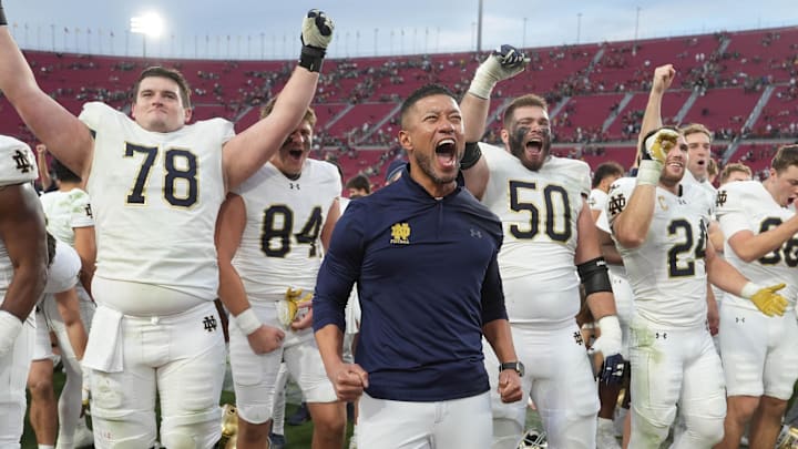 Nov 30, 2024; Los Angeles, California, USA; Notre Dame Fighting Irish head coach Marcus Freeman celebrates with players at the end of the game against the Southern California Trojans at United Airlines Field at Los Angeles Memorial Coliseum. Nov 30, 2024; Los Angeles, California, USA; Notre Dame Fighting Irish head coach Marcus Freeman celebrates with players at the end of the game against the Southern California Trojans at United Airlines Field at Los Angeles Memorial Coliseum.
