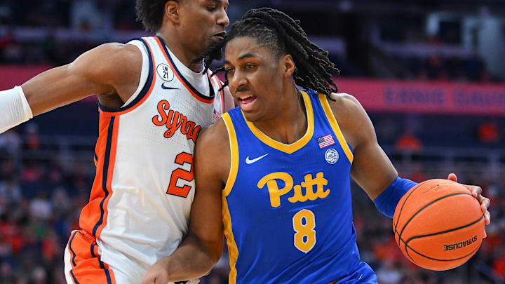 Mar 7, 2026; Syracuse, New York, USA; Pittsburgh Panthers guard Omari Witherspoon (8) drives against Syracuse Orange guard J.J. Starling (2) during the first half at the JMA Wireless Dome. Mandatory Credit: Rich Barnes-Imagn Images