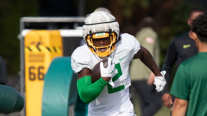 Oregon Ducks wide receiver Gary Bryant Jr. carries the ball during practice with the Ducks Tuesday, Sept. 3, 2024, at the Hatfield-Dowlin Complex in Eugene, Ore. Oregon Ducks wide receiver Gary Bryant Jr. carries the ball during practice with the Ducks Tuesday, Sept. 3, 2024, at the Hatfield-Dowlin Complex in Eugene, Ore.