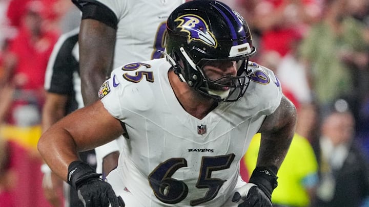 Sep 5, 2024; Kansas City, Missouri, USA; Baltimore Ravens guard Patrick Mekari (65) at the line of scrimmage against the Kansas City Chiefs during the game at GEHA Field at Arrowhead Stadium. Mandatory Credit: Denny Medley-Imagn Images