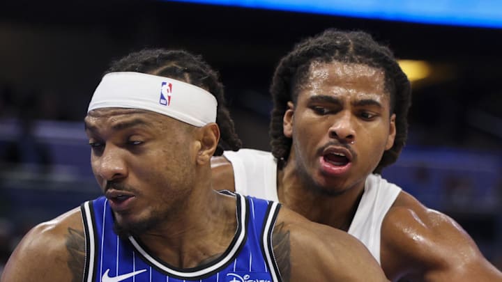 Orlando Magic center Wendell Carter Jr. drives to the basket past Toronto Raptors forward Collin Murray-Boyles.
