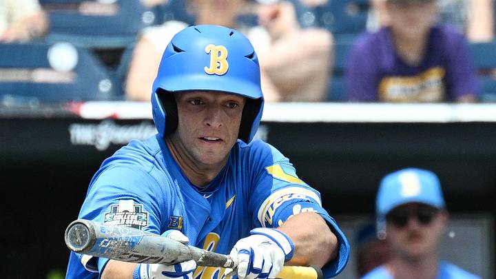 Jun 14, 2025; Omaha, Neb, USA;  UCLA Bruins shortstop Roch Cholowsky (1) bunts in a run against the Murray State Racers during the fourth inning at Charles Schwab Field. Mandatory Credit: Steven Branscombe-Imagn Images