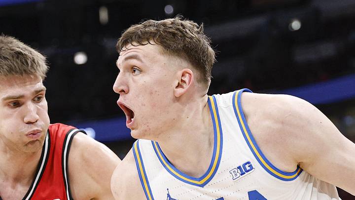 Mar 12, 2026; Chicago, IL, USA; UCLA Bruins forward Tyler Bilodeau (34) drives to the basket against Rutgers Scarlet Knights guard Harun Zrno (13) during the second half at United Center. Mandatory Credit: Kamil Krzaczynski-Imagn Images