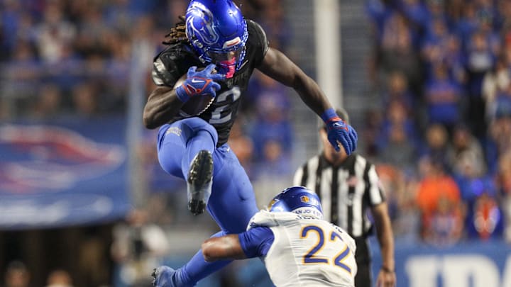 Oct 7, 2023; Boise, Idaho, USA; Boise State Broncos running back Ashton Jeanty (2) jumps over San Jose State Spartans safety Tre Jenkins (22) during the second half at Albertsons Stadium. Boise State defeats San Jose State 35-27. Mandatory Credit: Brian Losness-Imagn Images