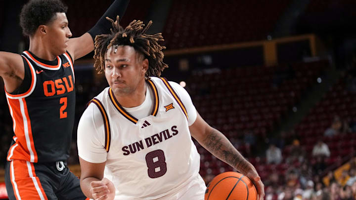ASU Sun Devils forward Marcus Adams Jr. (8) drives past Oregon State Beavers guard Josiah Lake II (2) at Desert Financial Arena in Tempe on Dec. 21, 2025.