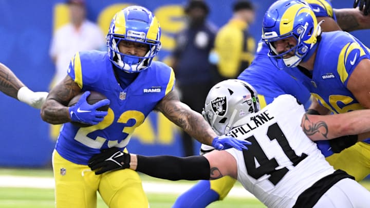 Oct 20, 2024; Inglewood, California, USA; Las Vegas Raiders running back Dylan Laube (23) runs against Las Vegas Raiders linebacker Robert Spillane (41) at SoFi Stadium. Mandatory Credit: Alex Gallardo-Imagn Images