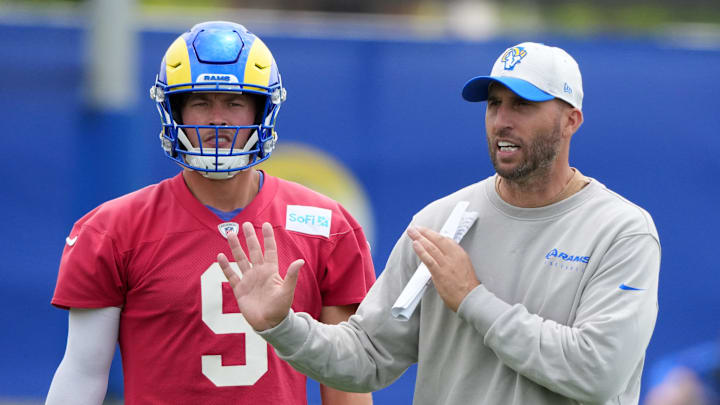 Jun 3, 2025; Woodland Hills, CA, USA; Los Angeles Rams quarterback Matthew Stafford (9) and quarterbacks coach Dave Ragone during organized team activities at Rams Practice Facility. Mandatory Credit: Kirby Lee-Imagn Images