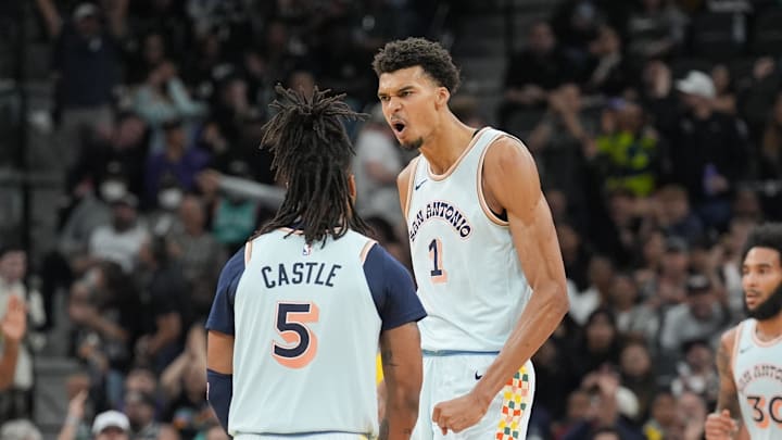 Nov 27, 2024; San Antonio, Texas, USA;  San Antonio Spurs guard Stephon Castle (5) and center Victor Wembanyama (1) celebrate in the second half against the Los Angeles Lakers at Frost Bank Center. Mandatory Credit: Daniel Dunn-Imagn Images