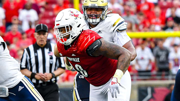 Louisville defensive tackle Rene Konga (90) pressures Georgia Tech quarterback Haynes King (10)