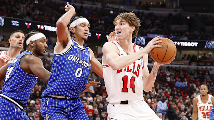 Jan 2, 2026; Chicago, Illinois, USA; Chicago Bulls forward Matas Buzelis (14) goes to the basket against Orlando Magic guard Anthony Black (0) during the first half at United Center. Mandatory Credit: Kamil Krzaczynski-Imagn Images