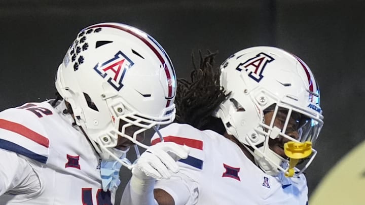 Nov 1, 2025; Boulder, Colorado, USA; Arizona Wildcats wide receiver Javin Whatley (6) celebrates his touchdown with wide receiver Tre Spivey (12) second quarter against the Colorado Buffaloes at Folsom Field. Mandatory Credit: Ron Chenoy-Imagn Images