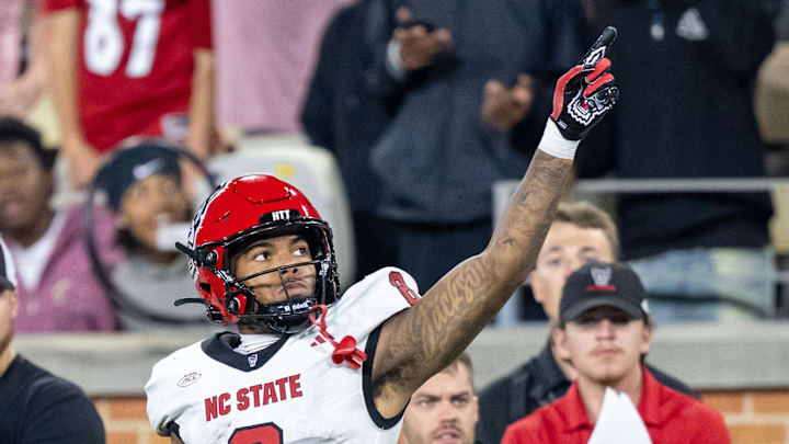 Sep 11, 2025; Winston-Salem, North Carolina, North Carolina State Wolfpack wide receiver Keenan Jackson (8) celebrates a first down against the Wake Forest Demon Deacons defensive back Karon Prunty (3) in the second half at Allegacy Federal Credit Union Stadium. Mandatory Credit: Luke Jamroz-Imagn Images 