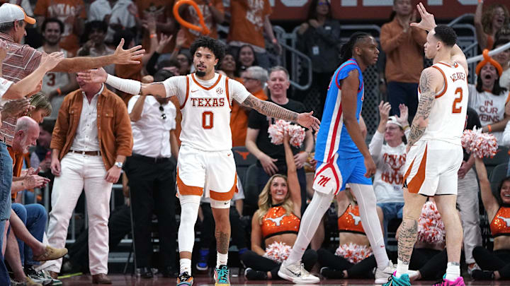 Texas Longhorns guard Jordan Pope celebrates a three point basket with fans during the second half against the Mississippi Rebels at Moody Center. 
