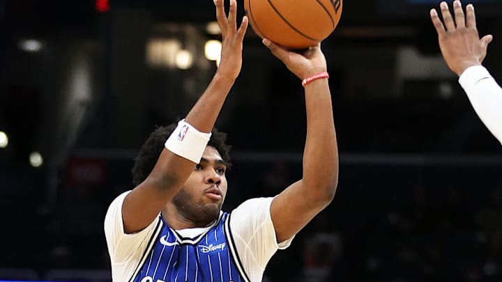 Jan 6, 2026; Washington, District of Columbia, USA; Orlando Magic guard Jase Richardson (11) takes a shot over Washington Wizards guard Bub Carrington (7) during the first half at Capital One Arena. Mandatory Credit: Daniel Kucin Jr.-Imagn Images
