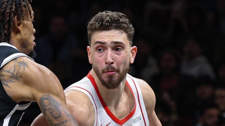Jan 1, 2026; Brooklyn, New York, USA; Houston Rockets center Alperen Sengun (28) is guarded by Brooklyn Nets center Nic Claxton (33) during the second half at Barclays Center. Mandatory Credit: Vincent Carchietta-Imagn Images