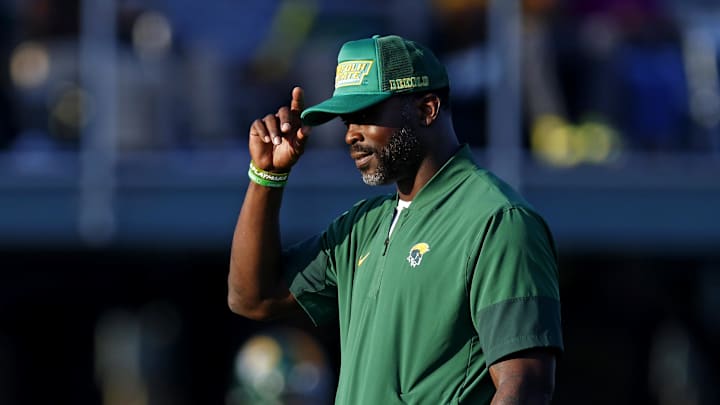 Norfolk State Spartans head coach Michael Vick watches his team warm up before the game against the Towson Tigers. Norfolk State Spartans head coach Michael Vick watches his team warm up before the game against the Towson Tigers.