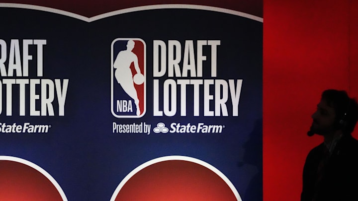 May 12, 2025; Chicago, Illinois, US; A person watches the 2025 NBA Draft Lottery at McCormick Place. Mandatory Credit: David Banks-Imagn Images