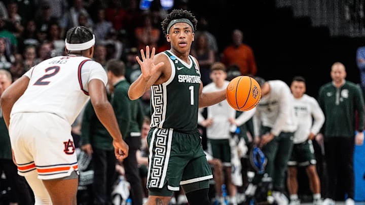 Michigan State guard Jeremy Fears Jr. (1) dribbles against Auburn guard Denver Jones (2) during the first half of the Elite Eight round of NCAA tournament at State Farm Arena in Atlanta on Sunday, March 30, 2025. Michigan State guard Jeremy Fears Jr. (1) dribbles against Auburn guard Denver Jones (2) during the first half of the Elite Eight round of NCAA tournament at State Farm Arena in Atlanta on Sunday, March 30, 2025.