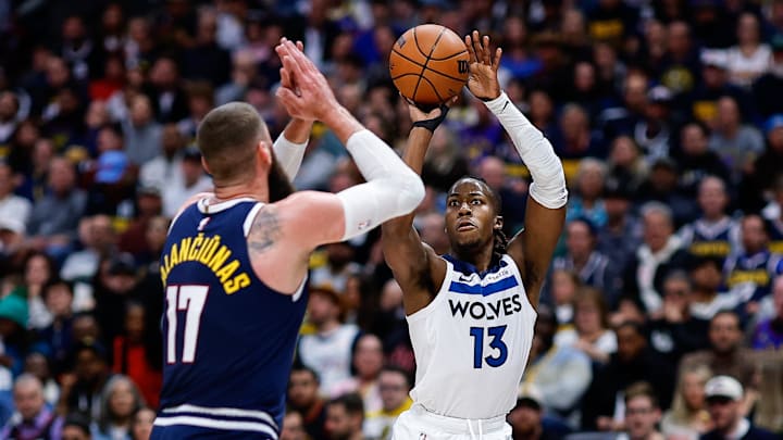 Apr 27, 2026; Denver, Colorado, USA; Minnesota Timberwolves guard Ayo Dosunmu (13) attempts a shot as Denver Nuggets center Jonas Valanciunas (17) defends in the second quarter during game five of the first round of the 2026 NBA Playoffs at Ball Arena. Mandatory Credit: Isaiah J. Downing-Imagn Images