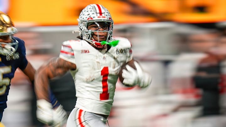 Ohio State Buckeyes running back Quinshon Judkins (1) gets away from the Notre Dame Fighting Irish defense for a long run in the third quarter during the College Football Playoff championship at Mercedes-Benz Stadium in Atlanta on January 20, 2025.