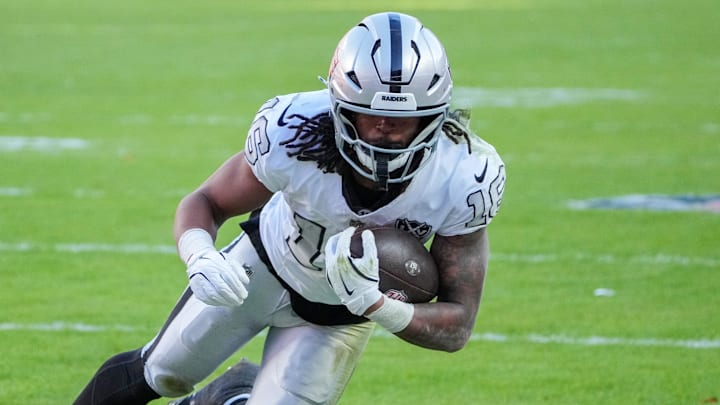 Nov 29, 2024; Kansas City, Missouri, USA; Las Vegas Raiders wide receiver Jakobi Meyers (16) runs the ball against the Kansas City Chiefs during the first half at GEHA Field at Arrowhead Stadium. Mandatory Credit: Denny Medley-Imagn Images