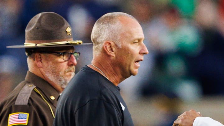 Notre Dame head coach Marcus Freeman, right, and NC State head coach Dave Doeren shake hands after Notre Dame won a NCAA football game 36-7 against NC State at Notre Dame Stadium on Saturday, Oct. 11, 2025, in South Bend.