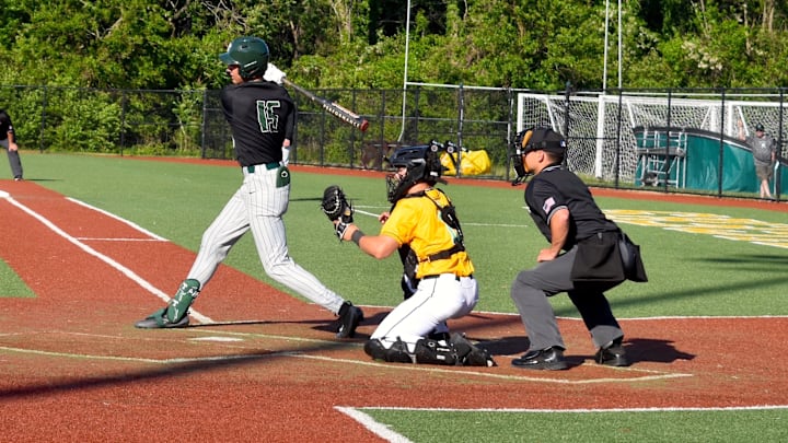 Trinity-Louisville center fielder and leadoff hitter, Max Phillips, swings at a pitch in a game against St. Xavier Wednesday, April 22, 2026. Trinity picked up the win in a battle between Kentucky baseball powerhouses.