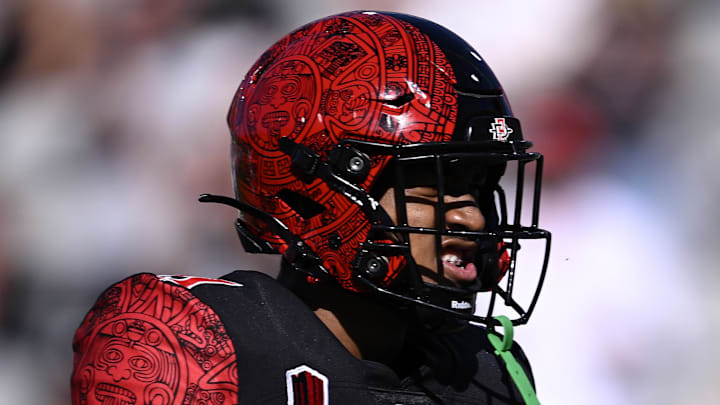 Aug 26, 2023; San Diego, California, USA; San Diego State Aztecs cornerback Chris Johnson (21) celebrates after a stop against the Ohio Bobcats during the first half at Snapdragon Stadium. Mandatory Credit: Orlando Ramirez-Imagn Images