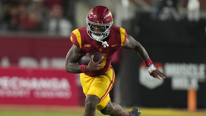 Oct 25, 2024; Los Angeles, California, USA; Southern California Trojans running back Woody Marks (4) carries the ball against the Rutgers Scarlet Knights in the second half at United Airlines Field at Los Angeles Memorial Coliseum. Mandatory Credit: Kirby Lee-Imagn Images