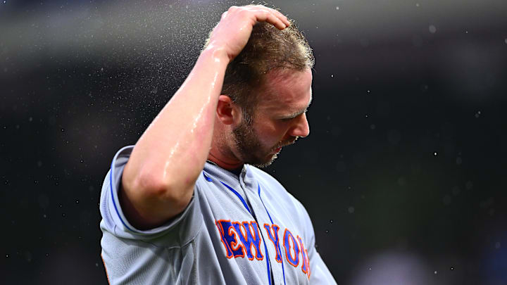 Jun 23, 2023; Philadelphia, Pennsylvania, USA; New York Mets first baseman Pete Alonso (20) wipes rain from his hair against the Philadelphia Phillies in the second inning at Citizens Bank Park. Mandatory Credit: Kyle Ross-Imagn Images