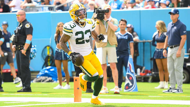 Sep 22, 2024; Nashville, Tennessee, USA; Green Bay Packers cornerback Jaire Alexander (23) scores a touchdown on an interception thrown by Tennessee Titans quarterback Will Levis (8) during the first half at Nissan Stadium. Mandatory Credit: Steve Roberts-Imagn Images
