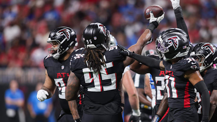 Atlanta Falcons DT Ta'Quon Graham (95) celebrates with teammates after recovering a fumble against the Detroit Lions.