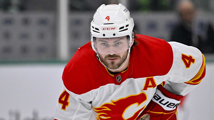 Dec 8, 2024; Dallas, Texas, USA; Calgary Flames defenseman Rasmus Andersson (4) in action during the game between the Dallas Stars and the Calgary Flames at American Airlines Center. Mandatory Credit: Jerome Miron-Imagn Images